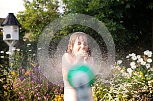 Child hosepipe water summer garden splash photo