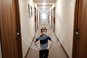 Child in hotel corridor