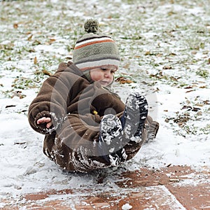 Child on icy slippery road