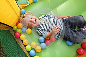 Child on inflatable bouncy castle photo