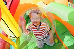 Child on inflatable bouncy castle