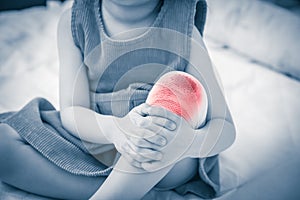 Child injured. Wound on child`s knee with bandage. Human health