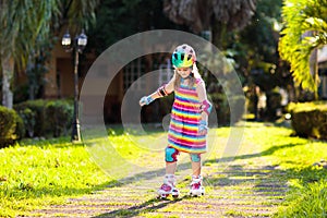 Child on inline skates. Kids skate roller blades