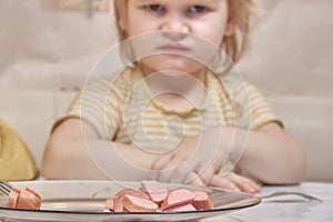 Child irritably refuses to eat meat concept of vegan