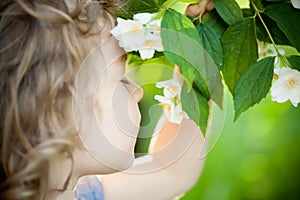 Child with jasmin flower