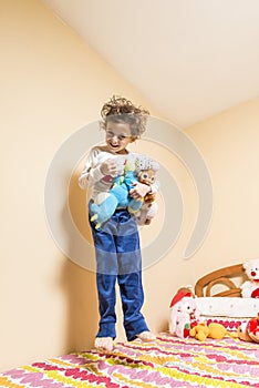 Child jumping on the bed