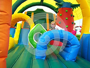 Child jumping in bouncy castle