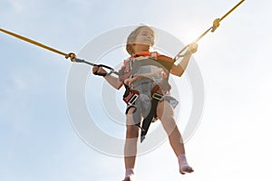 Child jumping child trampoline rubber bands