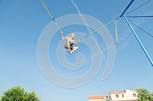 Child jumping in the jumping attraction