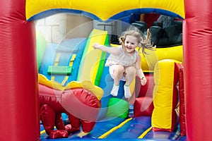 Child jumping on playground trampoline. Kids jump.