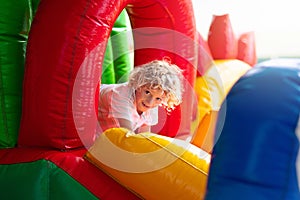 Child jumping on playground trampoline. Kids jump