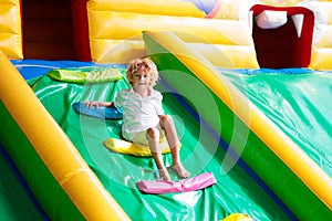 Child jumping on playground trampoline. Kids jump