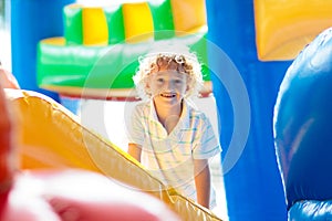 Child jumping on playground trampoline. Kids jump