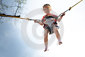 Child jumping child trampoline rubber bands