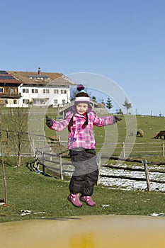 Child jumping on trampoline