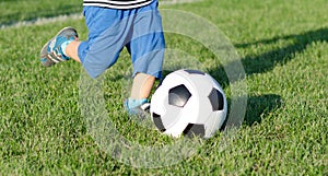 Child kicking a soccer ball