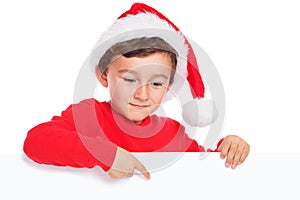 Child kid boy Christmas Santa Claus pointing empty banner copyspace isolated