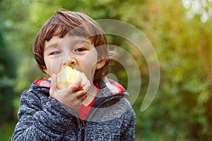 Child kid eating apple fruit outdoor autumn fall nature healthy