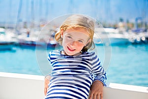 Child kid girl in marina boat on summer vacations