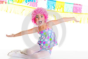 Child kid girl with party clown pink wig funny expression