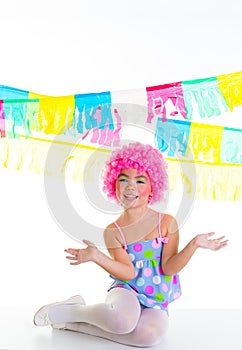 Child kid girl with party clown pink wig funny expression