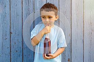Child kid little boy drinking cola lemonade drink copyspace copy