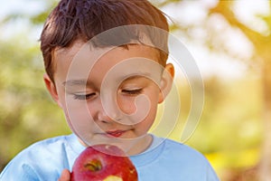 Child kid little boy eating apple fruit outdoor copyspace outdoors outside spring