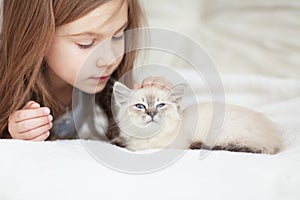 Child and kitten