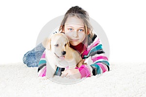 Child and labrador puppy