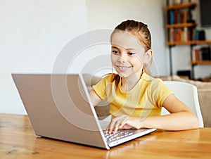 child laptop computer technology home girl education homework kid learning internet childhood student sitting connection