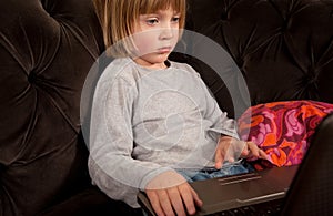 Child laptop sofa evening