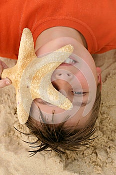 Child with a large starfish