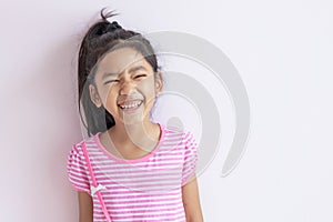 The child laughing and smiling with happiness