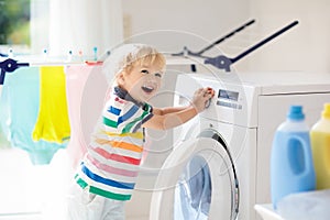 Child in laundry room with washing machine