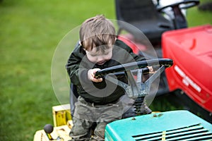 Child on lawn mower