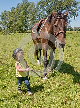 Child leading a horse