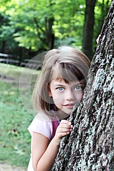 Child Leaning Against an Oak Tree