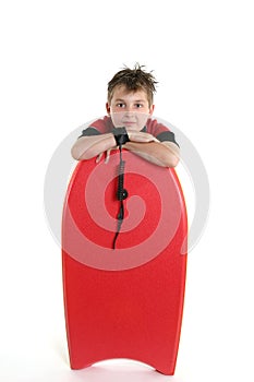 Child leaning on a bodyboard