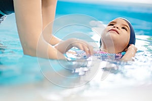 Child learn to float on back