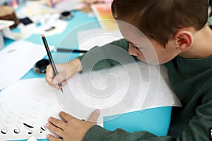 Child learning calligraphy