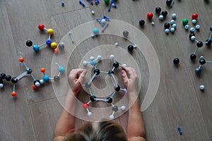 Child learning chemistry, building benzene ring, engineering and STEM