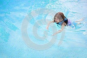 Child learning to swim