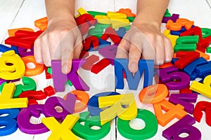 Child learning using magnetic numbers and letters