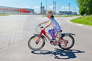 A child learns to ride a bicycle. Sport lifestyle