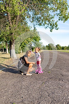 Child learns to roller skate. Roller skating