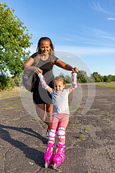 Child learns to roller skate. Roller skating