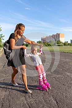 Child learns to roller skate. Roller skating