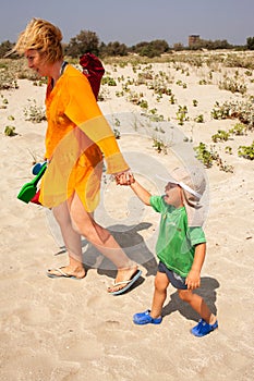 Child leaving beach crying