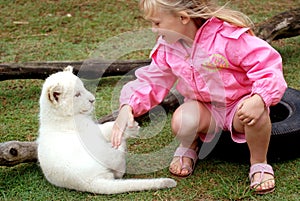 Child with lion cub