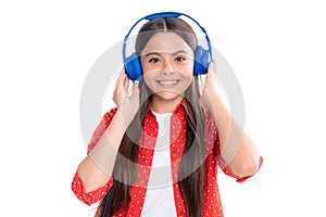 Child listening music with headphones. Girl listening songs via wireless earphones. Headset device accessory. Teenage